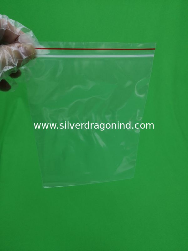 Transparent plastic ziplock bag with red line, size 140x200x0.055mm