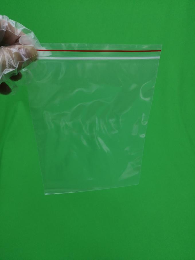 Transparent plastic ziplock bag with red line, size 250x345x0.060mm