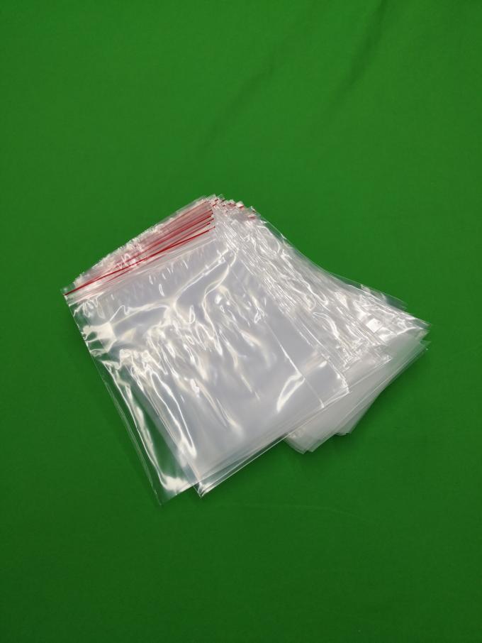 Clear reclosable plastic ziplock bags with red line, size 140x200x0.055mm