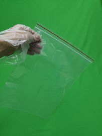 Transparent plastic ziplock bag with red line, size 250x345x0.060mm