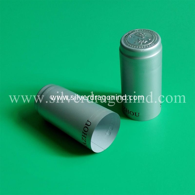 Silver color PVC shrink capsules for walnut oil sealing, top disc embossed, size customized